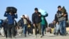 Afghan migrants deported from Iran arrive in the border town of Islam Qala in western Afghanistan.