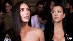 Kim Kardashian (left) and her sister, Kourtney (file photo)