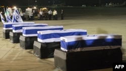 The coffins of five Israelis who were killed during the terror attack on a tour bus in Burgas, Bulgaria, resting at Ben Gurion International Airport near Tel Aviv on July 20. 