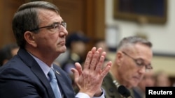 U.S. Defense Secretary Ash Carter (left) and Joint Chiefs Chairman Marine Corps General Joseph Dunford testify before a House Armed Services Committee hearing in Washington, D.C., on December 1.