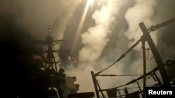 A ship fires missiles at an undisclosed location after U.S. President Donald Trump launched military strikes against Yemen's Iran-aligned Houthis on March 15, 2025. 