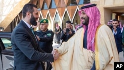 Saudi Crown Prince Mohammed bin Salman greets Syria's interim president, Ahmad al-Sharaa, at the royal palace in Riyadh on February 2.